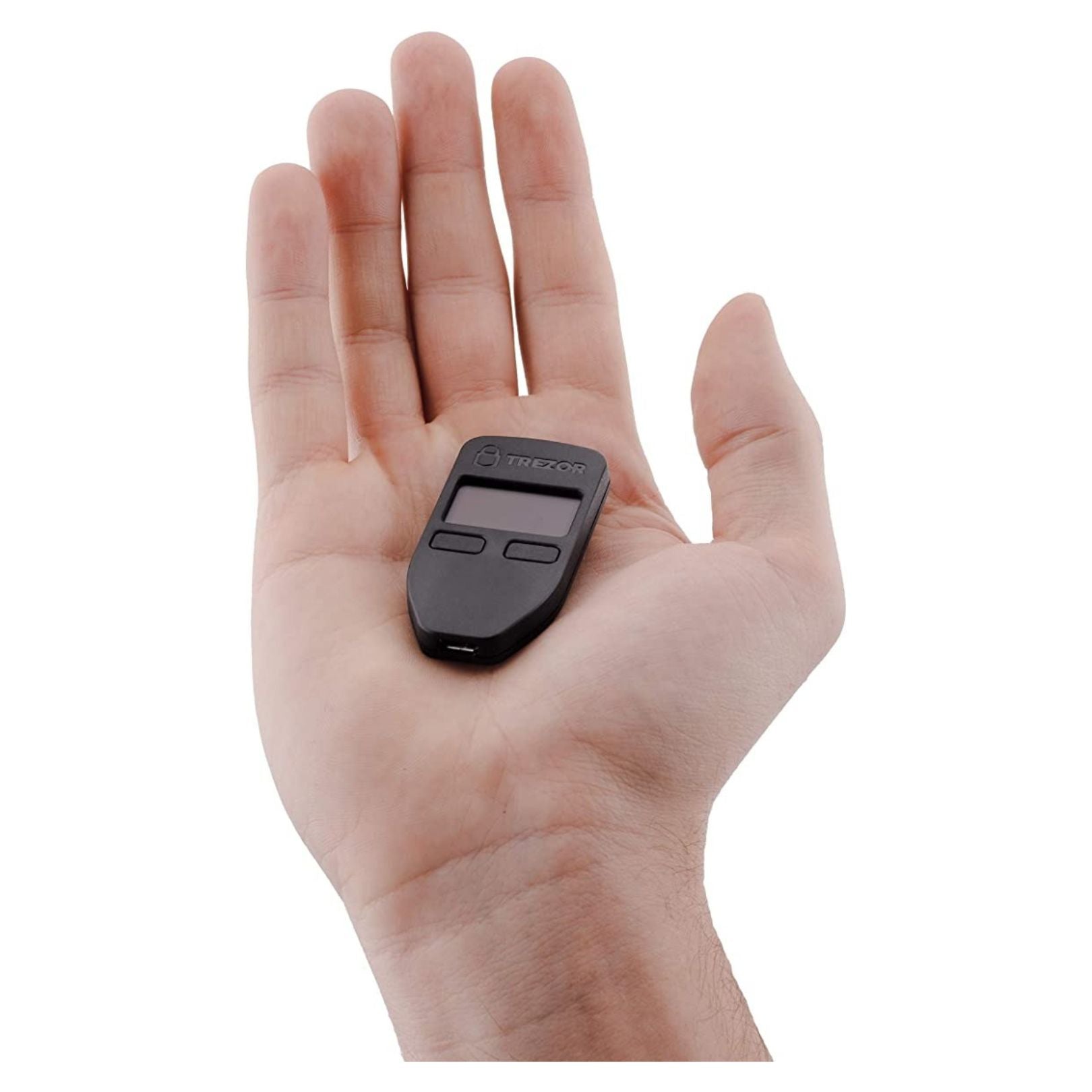 Hand holding a Trezor Model One crypto cold storage wallet.